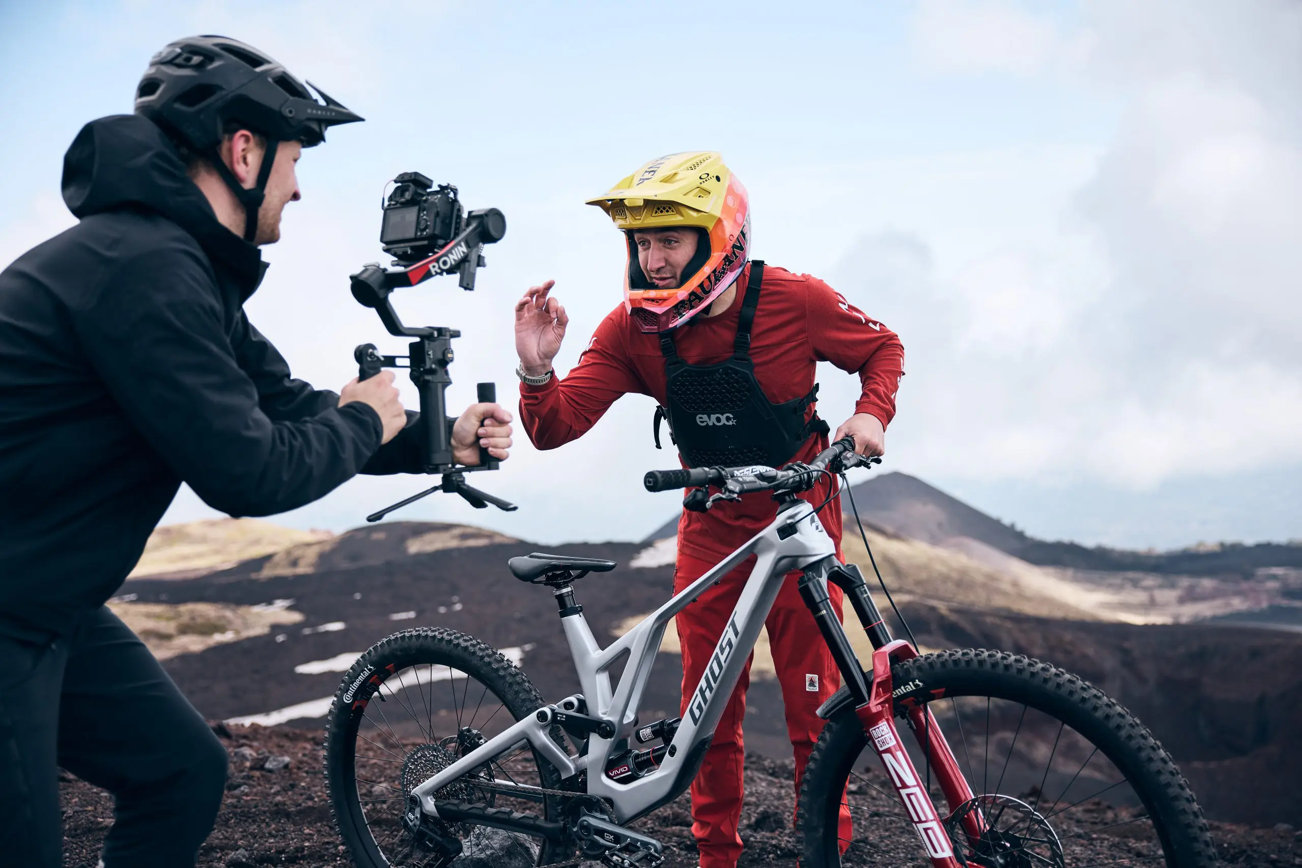 Mountain biker and videographer at Mountain Bike Press Camp, showcasing mountain bike content creation and marketing agency collaboration. LOAM.