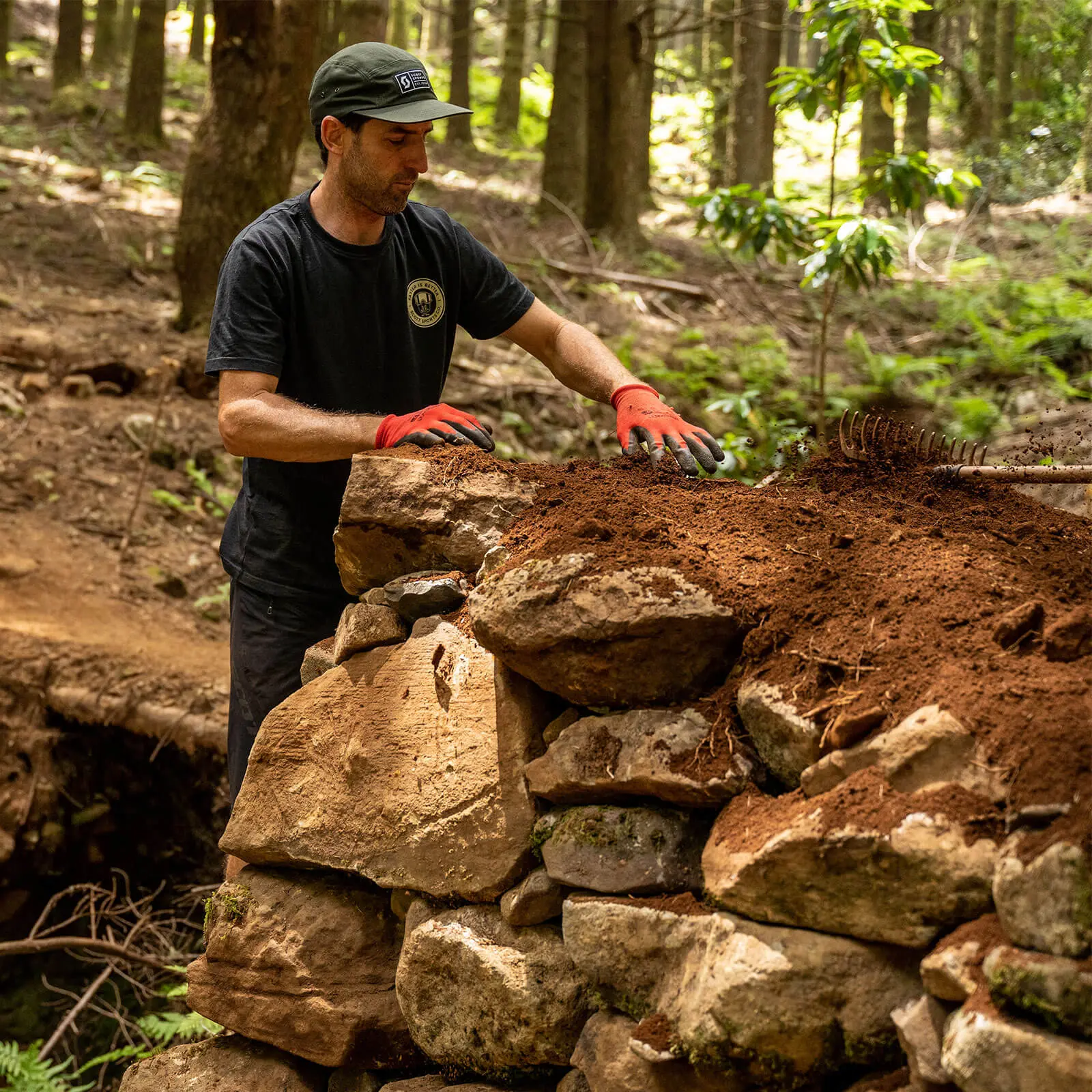 Mountain bike content creation expert building trail features, essential for a mountain bike event planner and marketing agency. LOAM.