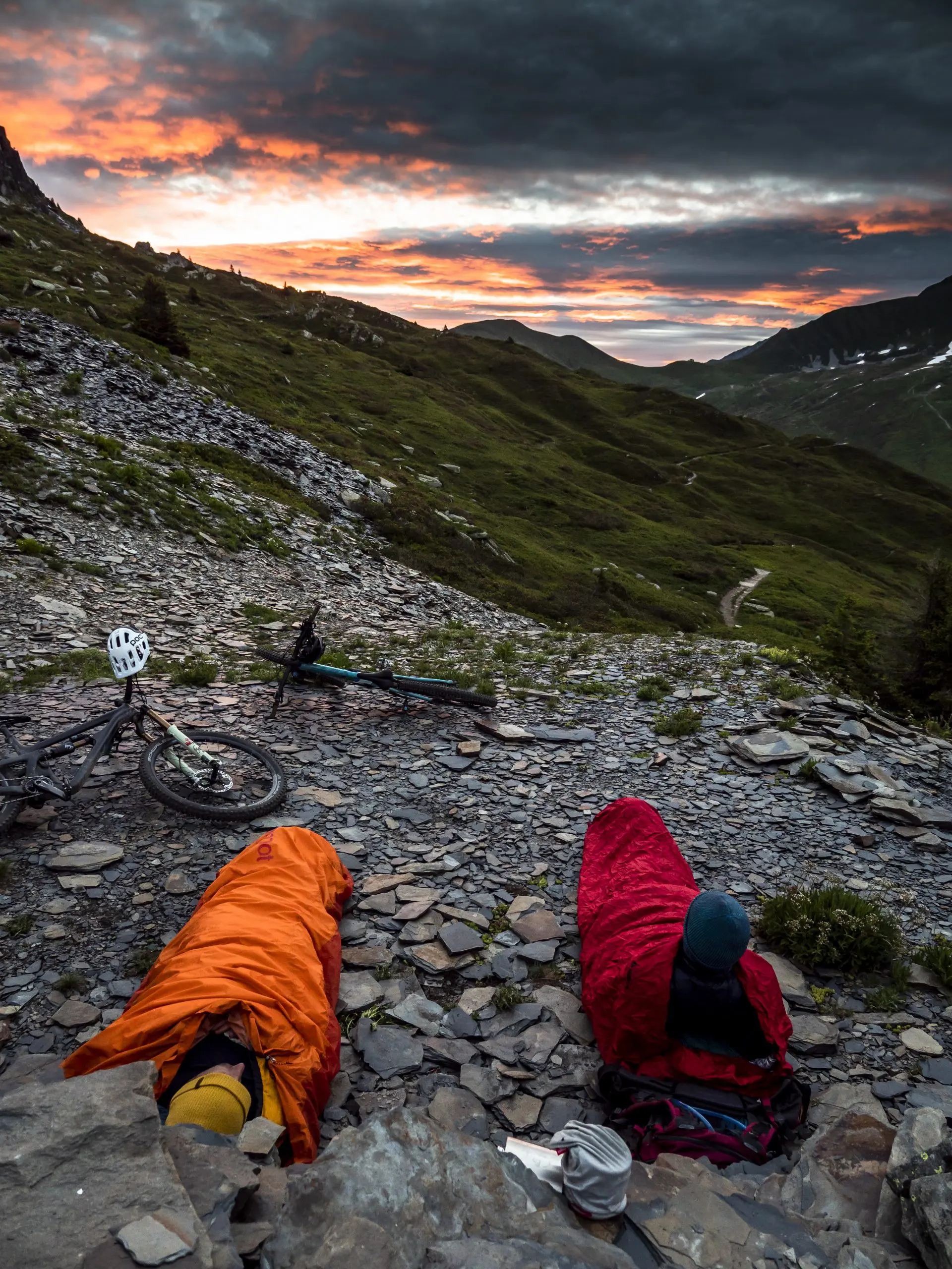 Mountain bikers camp at sunset, ideal for Mountain Bike Ambassador Management, Marketing Agency, Event Planning, and Content Creation. LOAM.