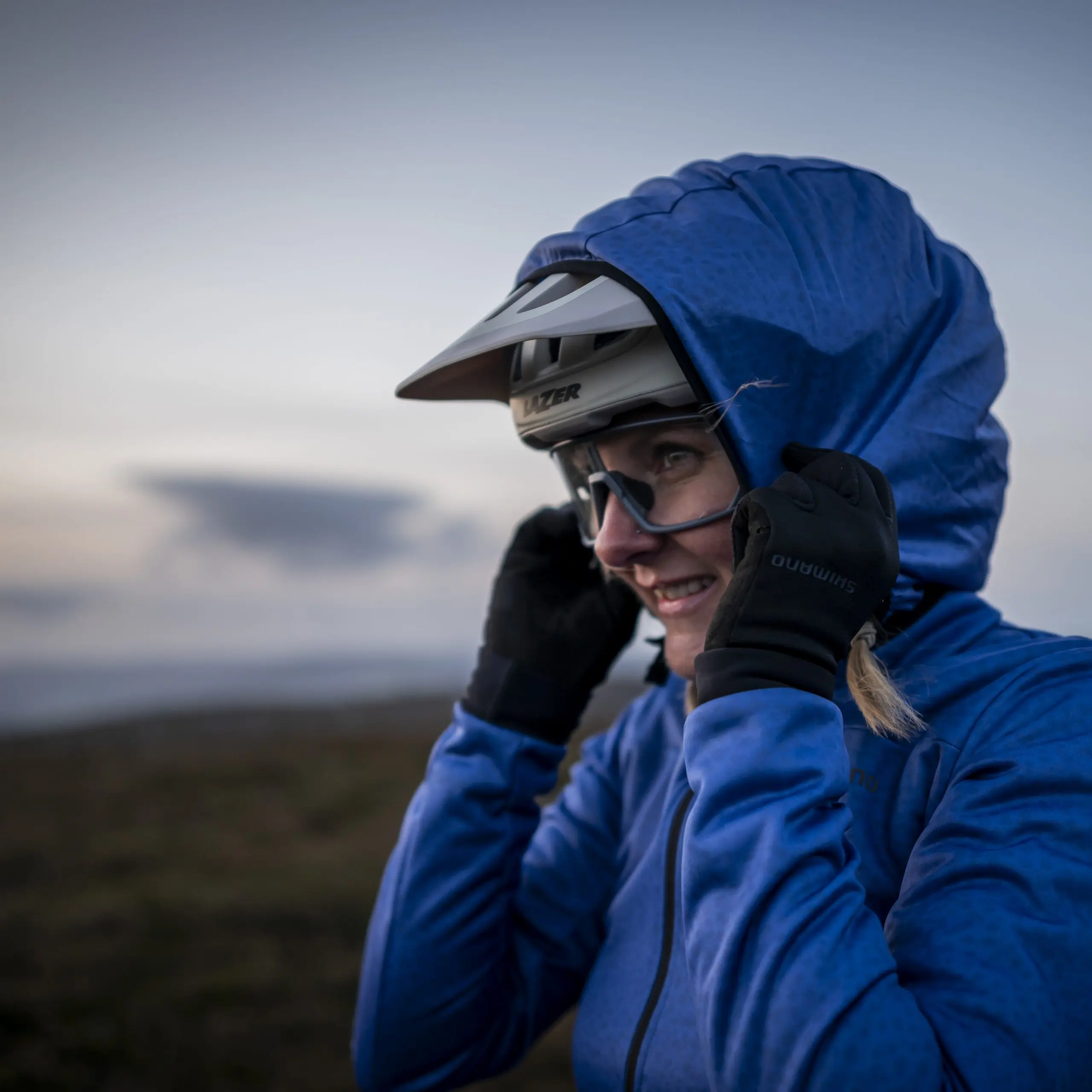Mountain bike enthusiast prepares for ride, showcasing ambassador management. Ideal image for mountain bike marketing agency and content creation. LOAM.