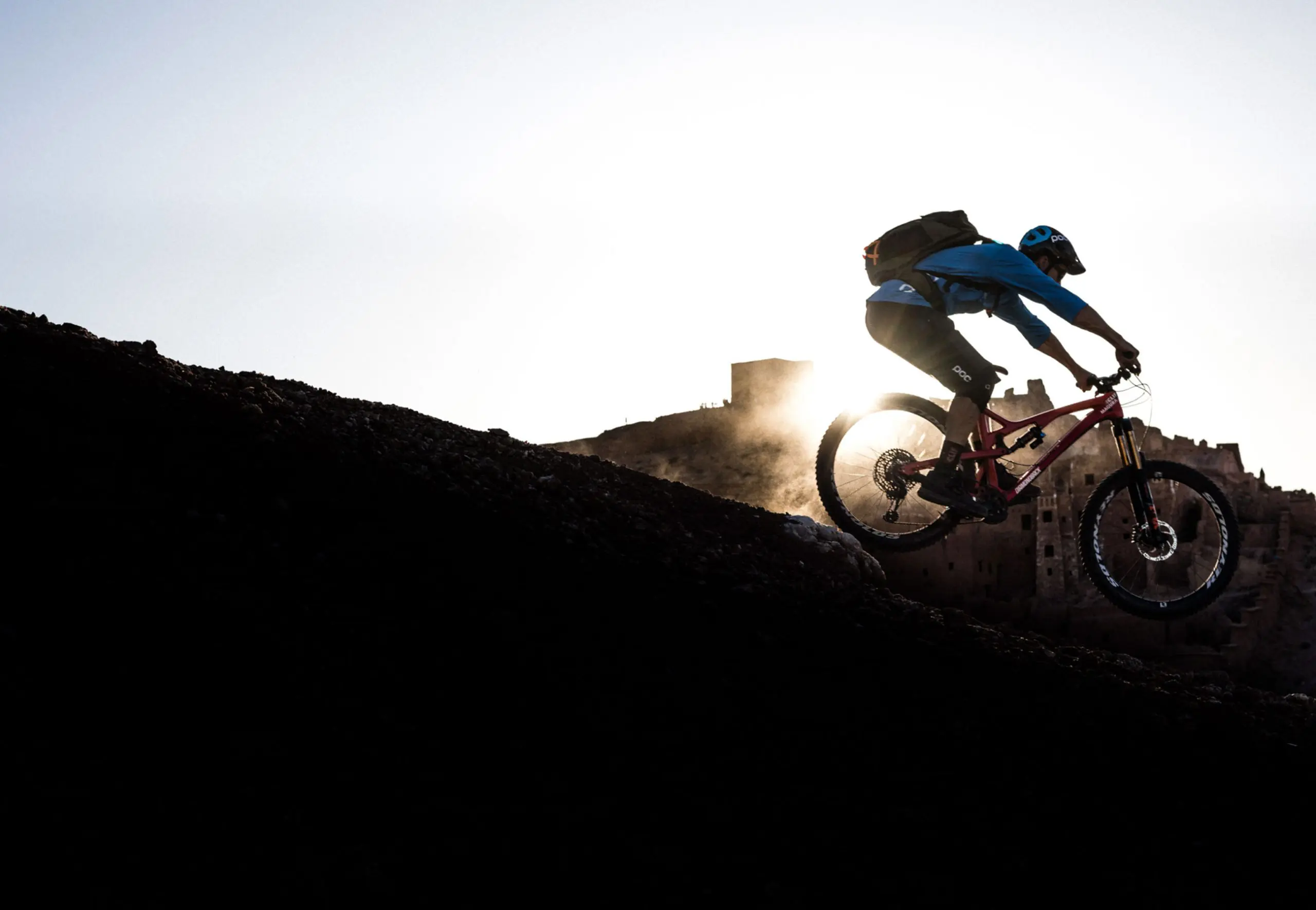 Mountain biker on trail, showcasing Outdoor Sports Marketing, Mountain Bike Content Creation, and Mountain Bike Event Planner expertise. LOAM.