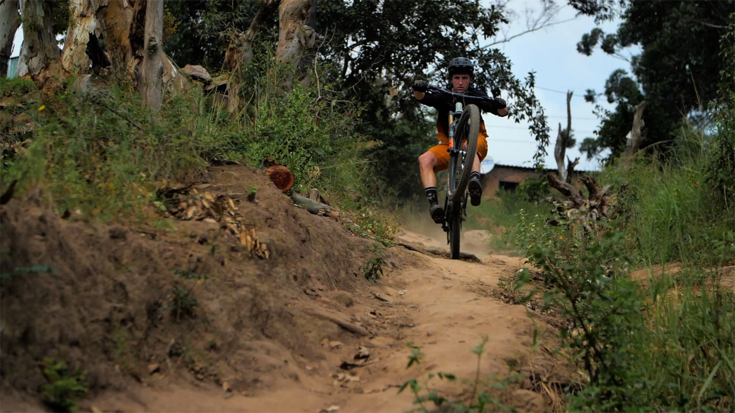 Mountain biker riding rugged trail, showcasing ambassador management, marketing agency skills, and event planner expertise in mountain biking. LOAM.