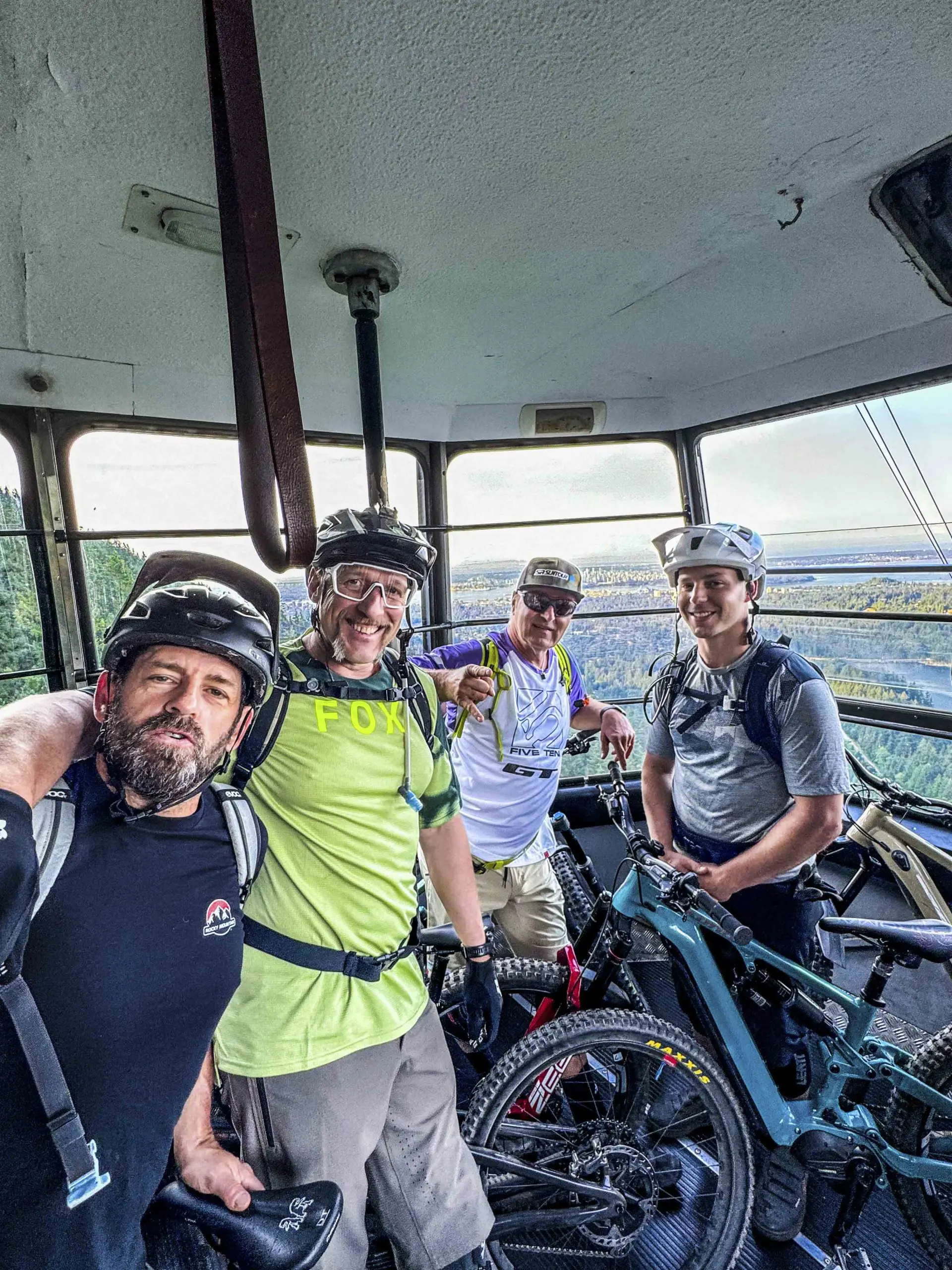 Mountain Bike Ambassadors in a gondola with bikes, showcasing Mountain Bike Marketing, Press Camp Planning, and Event Organization projects. LOAM.