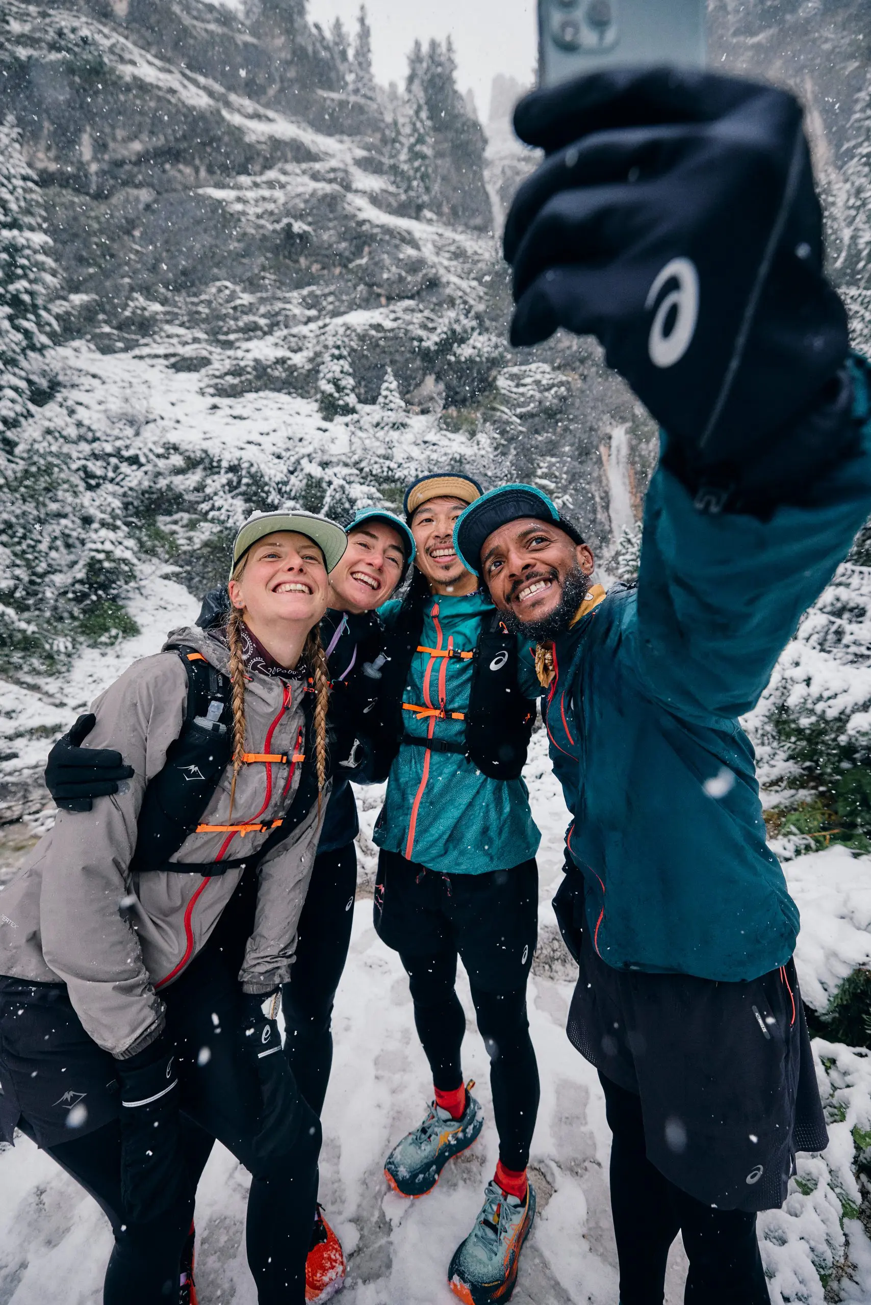 Group enjoys snowy mountain hike, highlighting Mountain Bike Project Logistical Support and outdoor sports event planning in alpine terrain. LOAM.