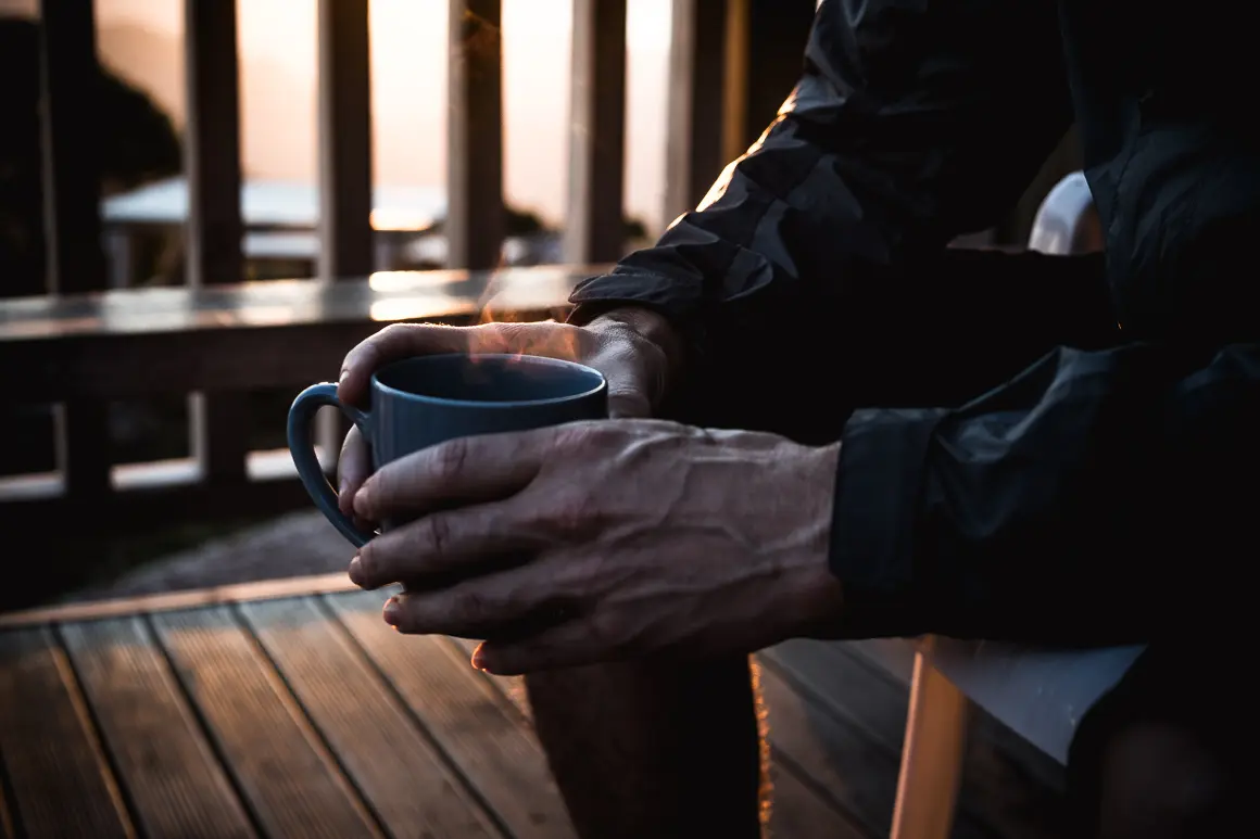 Morning coffee on a global trail adventure with LOAM. Euan Wilson preps for mountain bike event planning and content creation at sunrise. LOAM.