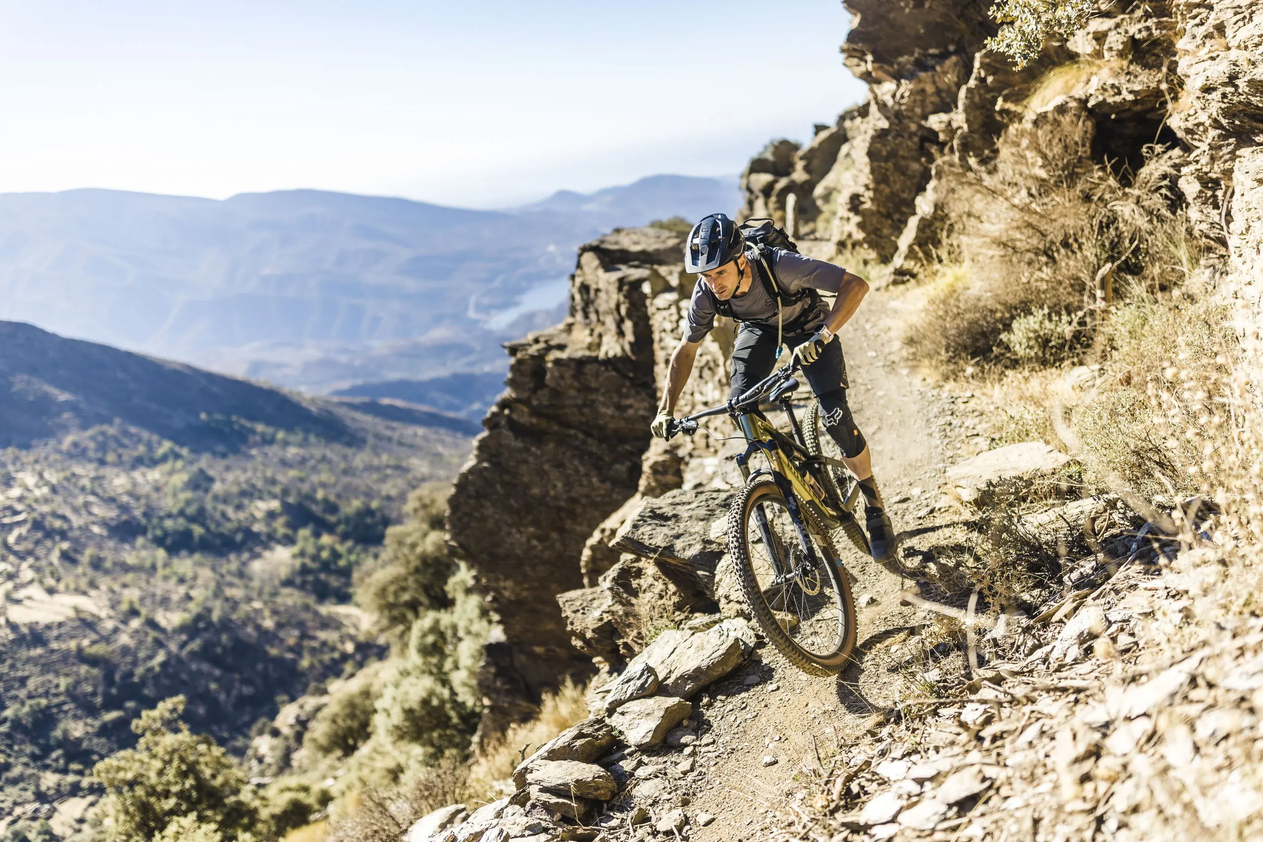 Mountain biking on rugged terrain during a Mountain Bike Press Camp, showcasing Mountain Bike Marketing Agency and Content Creation strategies. LOAM.