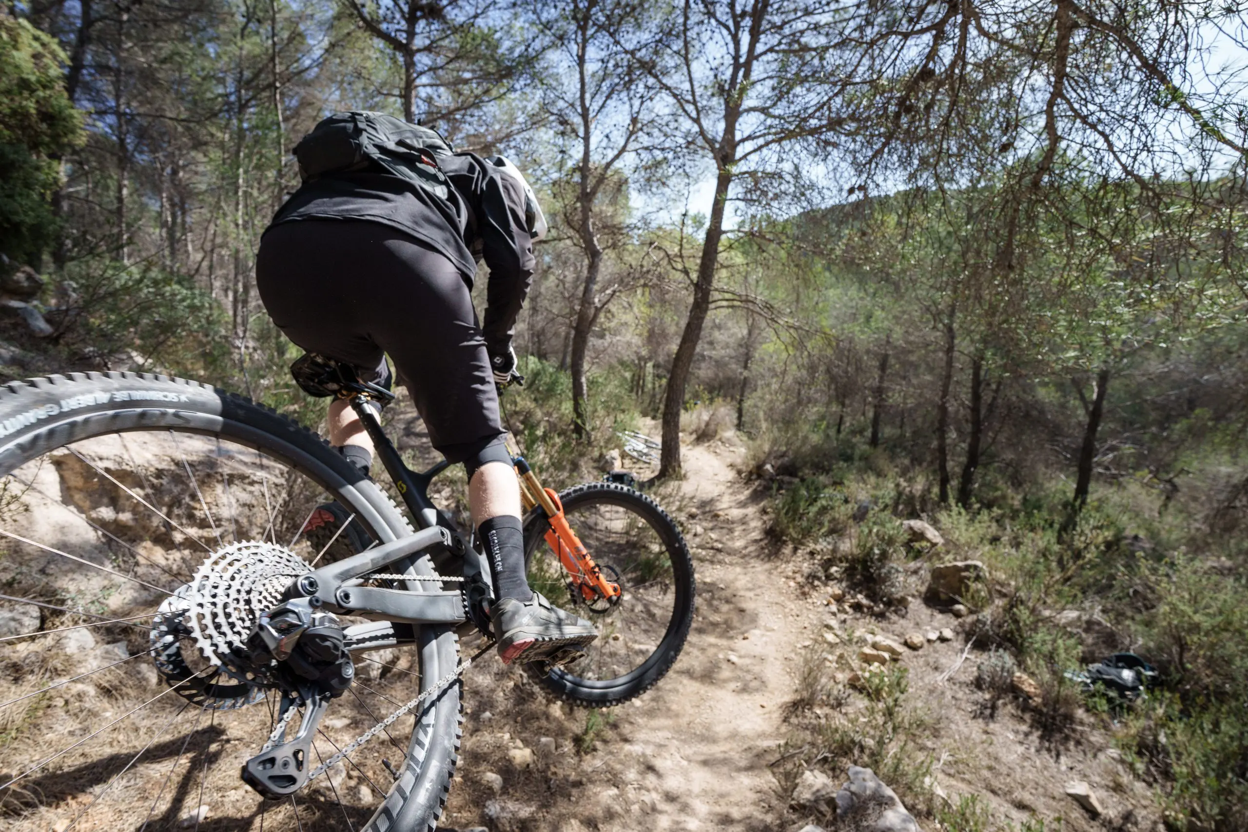 Mountain biker on trail at press camp, showcasing mountain bike marketing agency expertise, content creation, and event planning skills. LOAM.