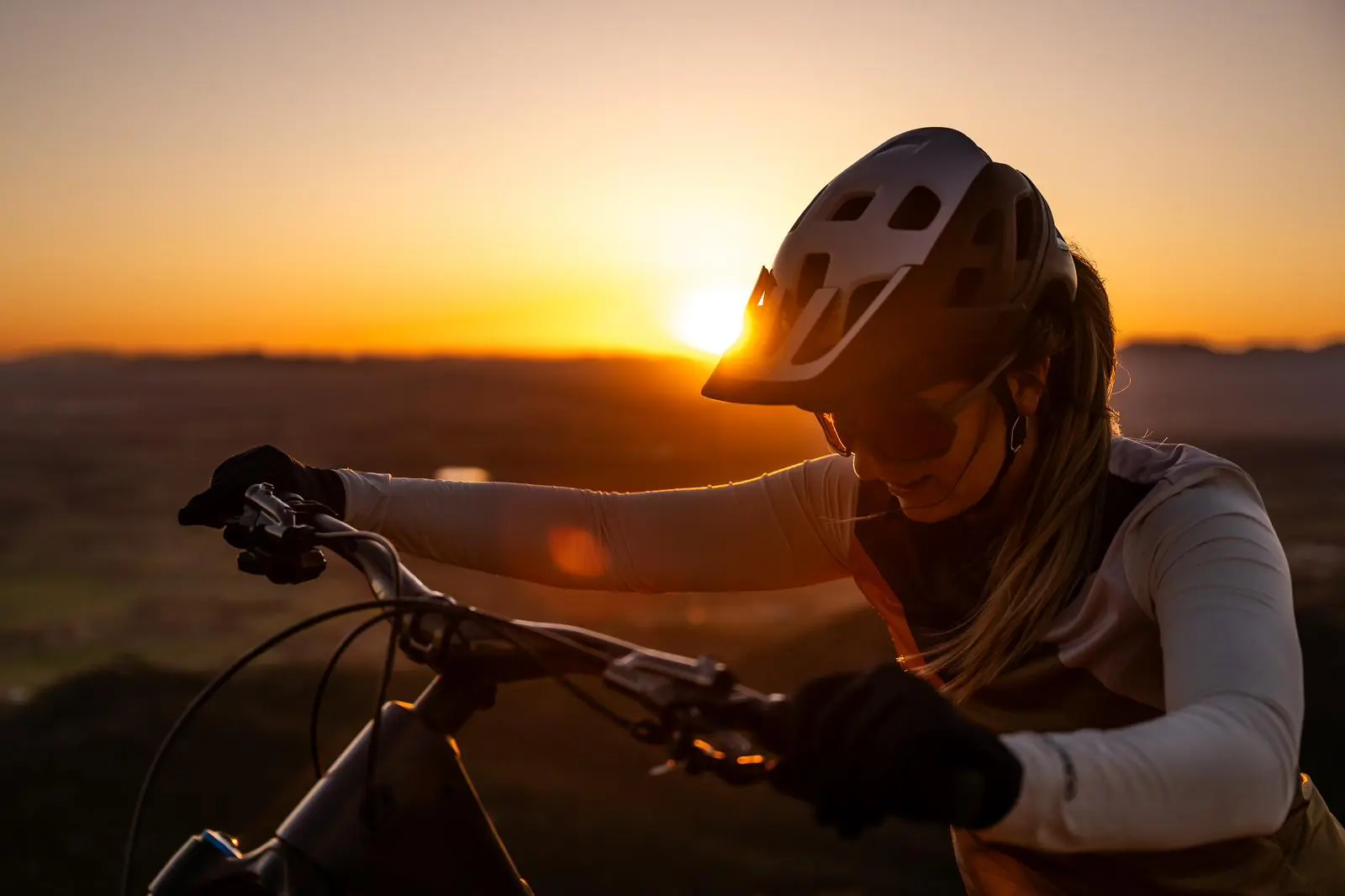 Mountain biking at sunset, ideal for Mountain Bike Press Camp, content creation, and event planning with logistical support from a marketing agency. LOAM.