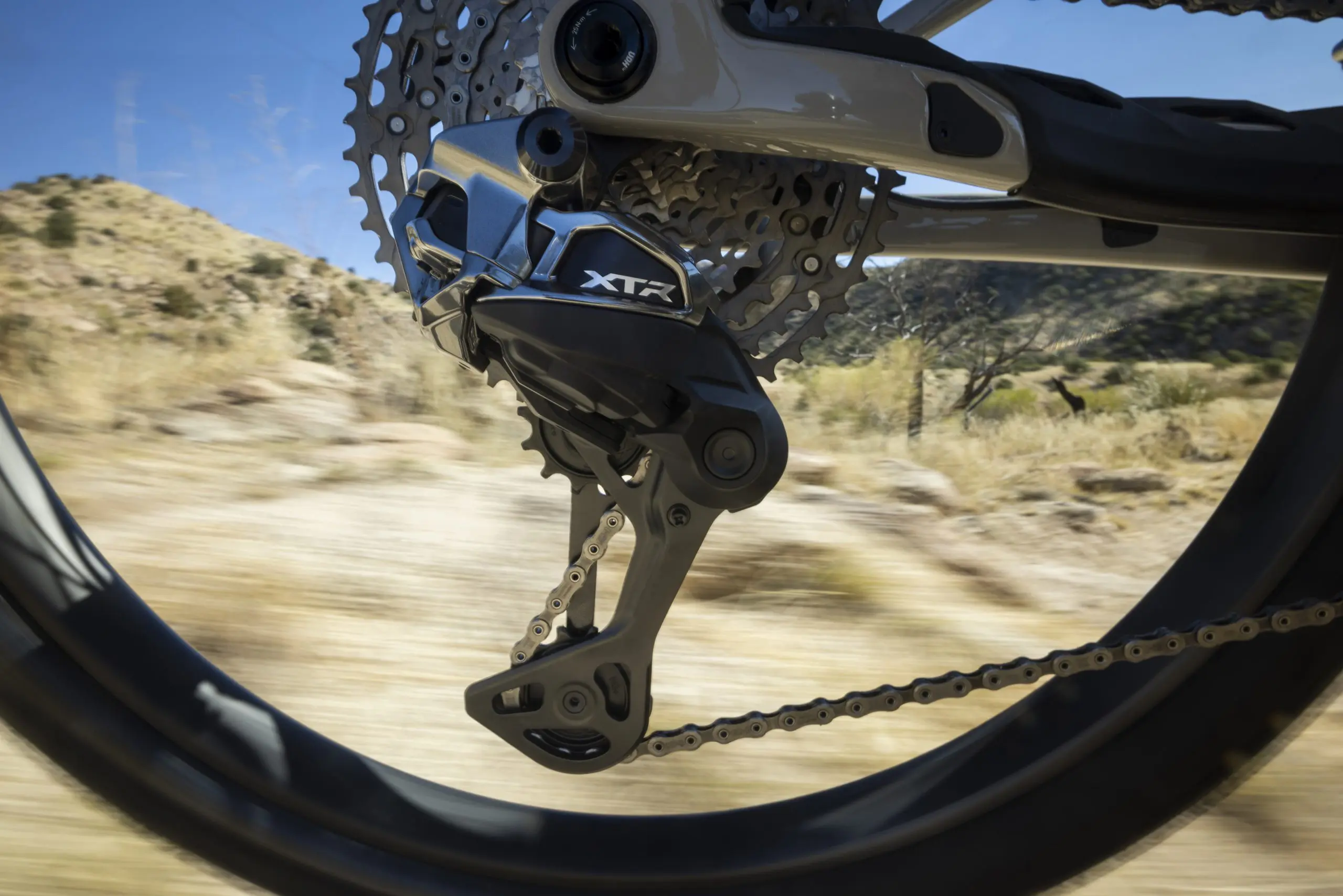 Mountain bike rear derailleur in motion, ideal for Mountain Bike Press Camp, Mountain Bike Content Creation, and Event Logistics Planning. LOAM.