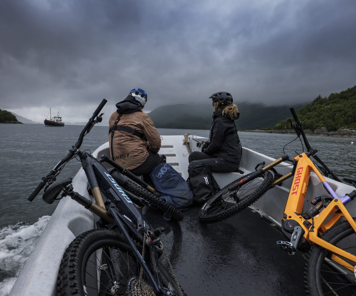 Mountain bikers with bikes on a boat, ideal for mountain bike content creation, marketing agency strategies, and event planner logistics. LOAM.