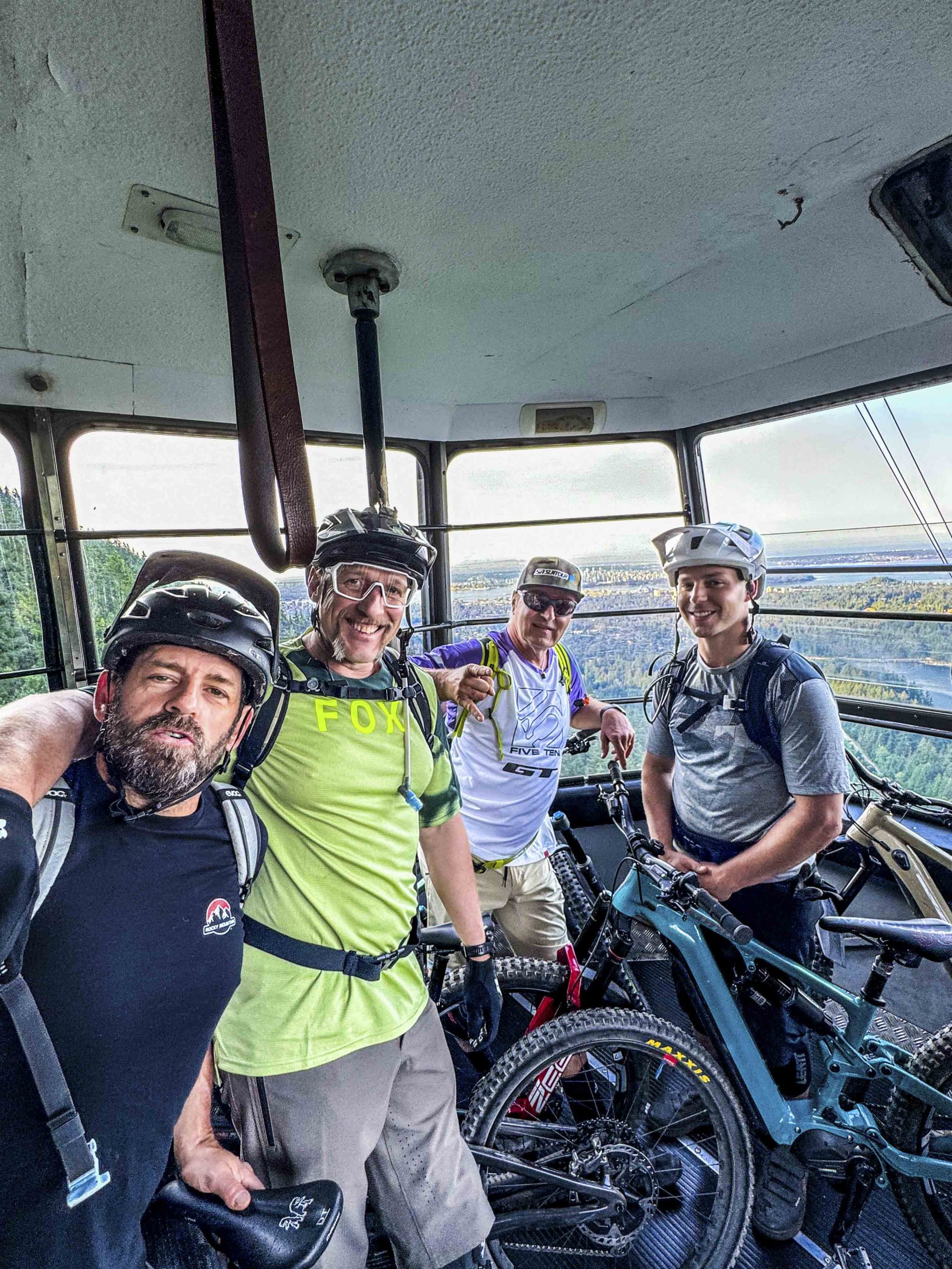 Mountain Bike Ambassadors in a gondola with bikes, showcasing Mountain Bike Marketing, Press Camp Planning, and Event Organization projects. LOAM.