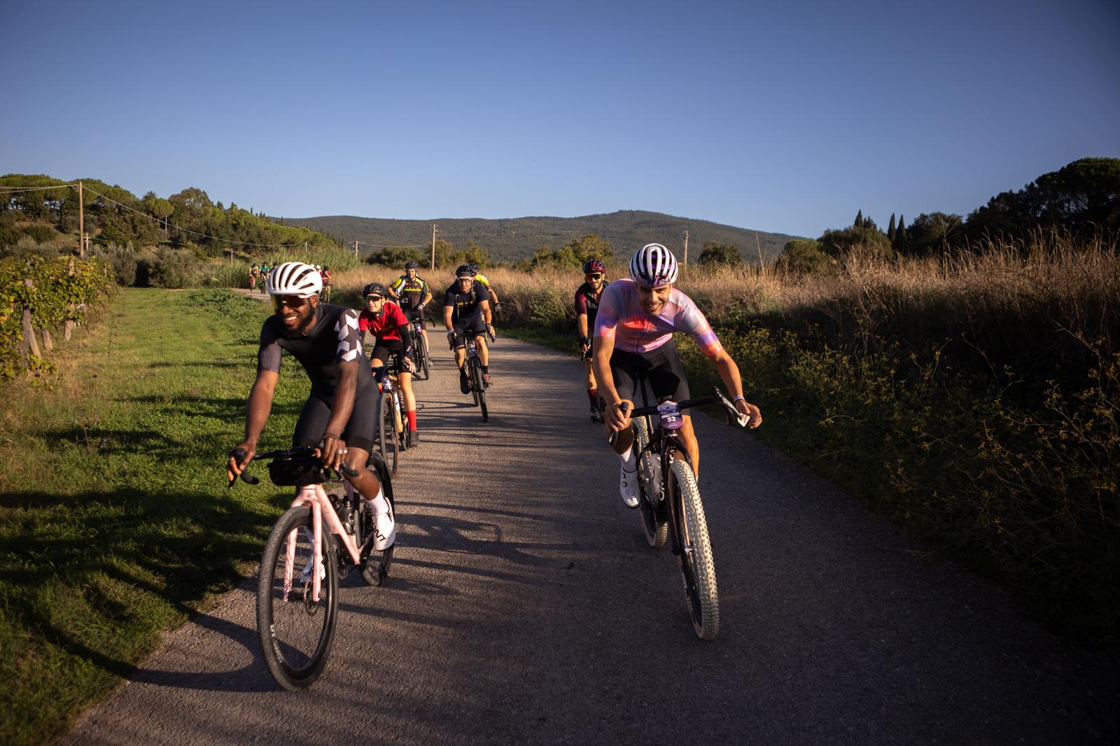 Group of cyclists on a mountain trail, ideal for a Mountain Bike Marketing Agency, Outdoor Sports Marketing, and Event Planning strategies. LOAM.